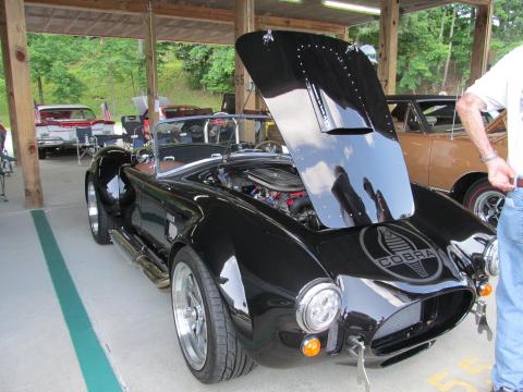 Dick Couture • Submitted Bill Henry’s Ford Cobra attracts a crowd and goes home with a “Club Choice” trophy.
