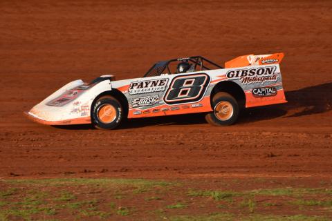 Travis Dockery • Clay County Progress “The Coach” David Payne pilots his Capital racecar around Tri County Racetrack during practice. Payne would go on to win the $2,000 top prize in the night’s main event.