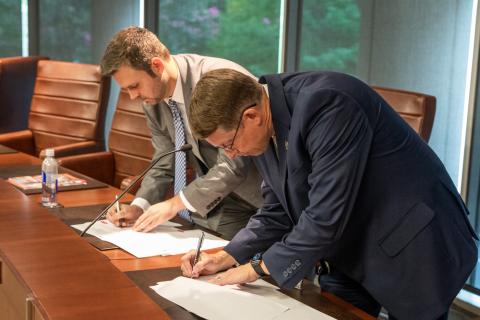 Georgia Department of Education Chief of Staff Matt Jones and TCSG Commissioner Greg Dozier sign articulation agreements that will allow students to receive TCSG college credits for certain Career, Technical, and Agricultural Education (CTAE) courses.