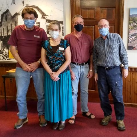 The monthly Small Town Main Street/Historic Hayesville Inc. meeting included a welcome by (L - R) Tommy Davis, Stu Jenner and Mayor Harry Baughn for a presentation by new Clay County Chamber Director Laura  Kleiss Hoeft (center) which included partner updates.            