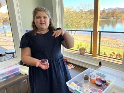 Marie Lance shows off her collection of toy "slime" at the home of her grandmother, Anita Lance. (Photo by Jared Putnam)