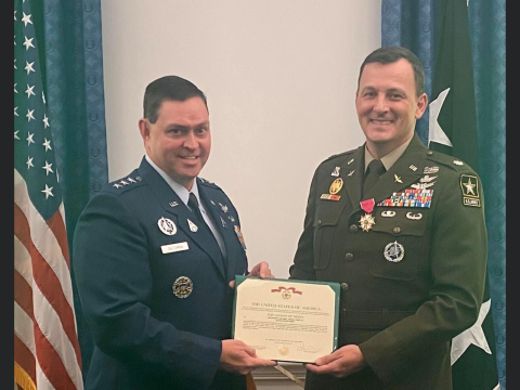 Lt. Col John Brian Davis, right, is honored as for his years of service. 
