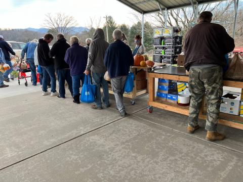 (Photo by Eric Meadows) Matt's Ministry volunteer Angie Kelly serves clients at Matt's Ministry Food Pantry on Saturday, December 4. They are open every Saturday from