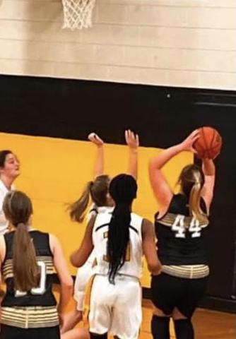 Ava Moore goes up strong in the paint for one of her six baskets from the floor
