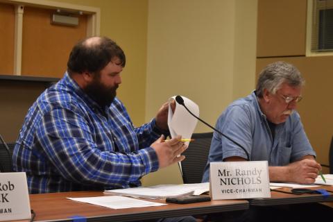 Commission Chair Randy Nichols and commissioner Dwight Penland review the moratorium that prevents crypto mining in the county for several months.