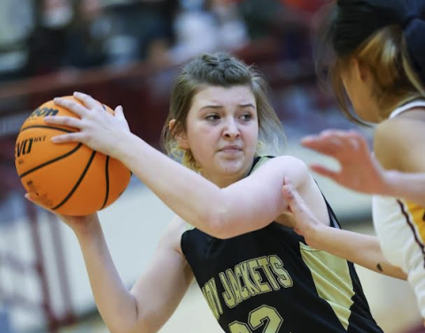 Kelli Graves • Clay County Progress Maple Mackey fights off Cherokee defense looking for an open.