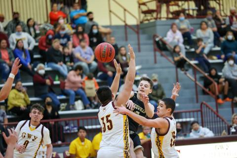 Kelli Graves • Clay County Progress Senior point guard Kolbe Ashe draws in the defense and dishes to an open teammate.
