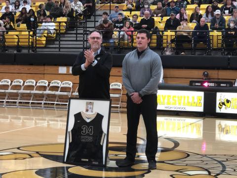 (Deby Jo Ferguson • Clay County Progress) On Jan. 28 at the game against Murphy, Hayesville High School Principal, Stacy Overland presented the honors of retiring #34 basketball jersey belonging to Zach Cottrell. The jersey will take it’s rightful place in the showcase along with the other retired jerseys and school trophies.