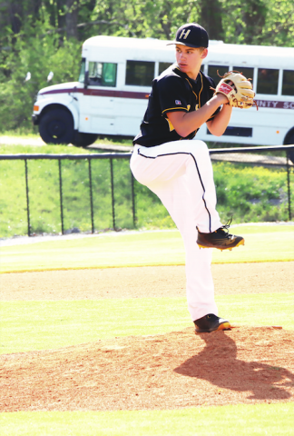 Braxton Cherry winds up for a take down pitch to a Cherokee batter.