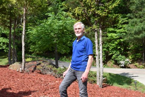 Marcia Barnes  • Clay County Progress Dwight Moss pauses for a moment in a garden area he planted at his home in Clay County.