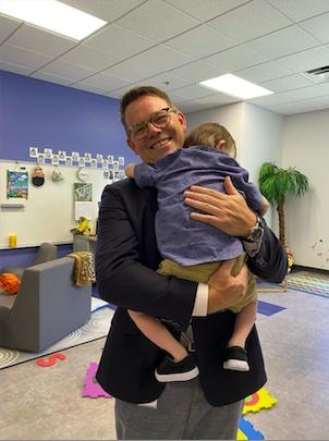 Photo submitted by Clay County Schools Clay County Schools Superintendent Dale Cole shares a comforting moment with a primary school student on the first day of school earlier this week. "We both needed it and made each other feel much better," Cole said.