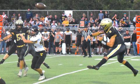 Gary Corsair • Clay County Progress Logan Caldwell, No. 6, rifles a second-down pass to Avery Leatherwood while Cameron Payne, No. 56, provides protection. Caldwell completed seven passes for 111 yards.