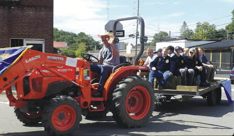 Becky Long • Clay County ProgressHayesville High School Future Farmers of America members participate in the Clay County Tractor Parade on Saturday, Sept. 24 on a tractor operated by Silas Brown. Members created a hay maze, obstacle course and entered a float. A highlight of the event was the raffle for a 1948 Ford 8N that had been restored by George Kresage of Murphy. The lucky winner was Florida resident, Maitland Dampier. Proceeds from the event go to the Dwight Smith Scholarship Fund. About 28 tractors 