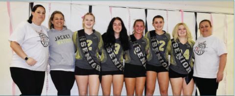 Gracie Taylor • Clay County Progress From left, Larkin Giddens, Julie Ledford, Trinity Frias, No. 2, Anneliese Schue, No. 13, Emma Shook,, No. 8, Katie Pierce, No. 22, Gracie Perry, No. 34, and Tammy Dills celebrate senior night