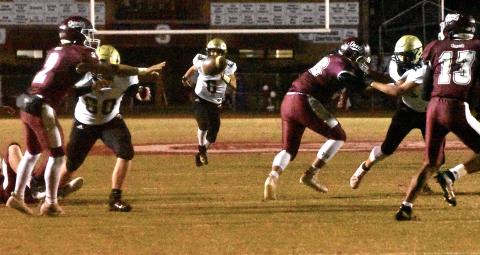 Gary Corsair • Clay County Progress Hayesville safety Logan Caldwell, No. 6, keeps his eyes on the prize as Swain County's Gabe Lillard, No. 2, pitches the ball as Yellow Jackets Lane O'Dell, No. 60, and Avery Leatherwood, No. 10, do their best to bust up the play.