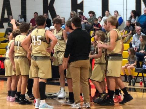 Deby Jo Ferguson • Clay County Progress Jackets get a pep talk during time out.