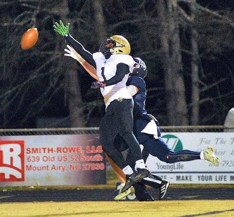 Zach Colburn • The Mount Airy News Hayesville's Asher Brown, No. 1 breaks up a pass in the first quarter of the Yellow Jackets third-round playoff game at Mount Airy.