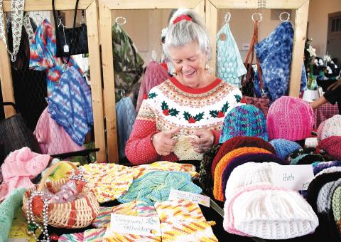 Becky Long • Clay County Progress Susie Brechbill continues to crochet items while working at her booth during the Made in the Mountains event where local vendors could sell their wares from the historic courthouse on Black Friday.