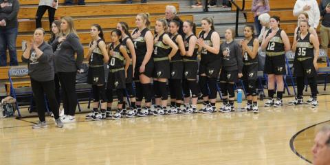 Photo by Kendra Coker Hayesville Middle School Lady Jackets shows respect during the Pledge of Allegiance.