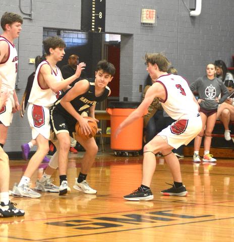 Gary Corsair• Clay County Progress Hayesville's Riley Rogers, No. 4, looks for a cutter after penetrating the heart of the Andrews defense on Monday.