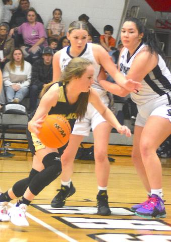 Gary Corsair • Clay County Progress Breanna Abrams, No. 4, cuts through the heart of the Robbinsville defense on a bold drive.