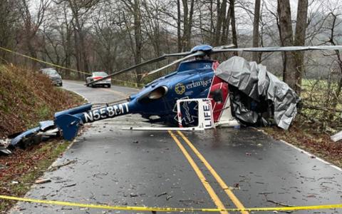 Wreckage of Life Force 6 blocks Middle Burningtown Road in Macon County on Friday on the morning following a crash. All four aboard survived.