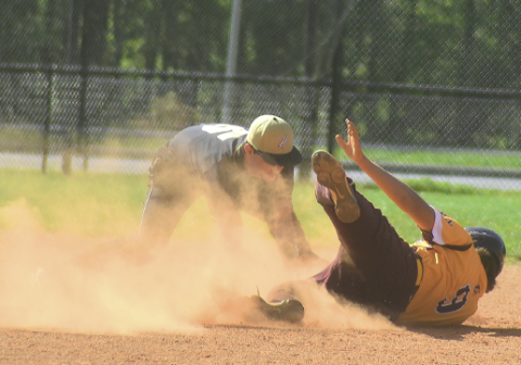 Gary Corsair • Clay County Progress Hayesville shortstop Dakota Matheson applies the tag to a Cherokee base runner on an attempted steal of second base. 