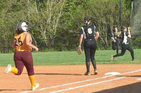 Gary Corsair • Clay County Progress Hayesville second baseman Raylyn Taylor, No. 11, catches a pop-up on the run near the fi rst base foul line.