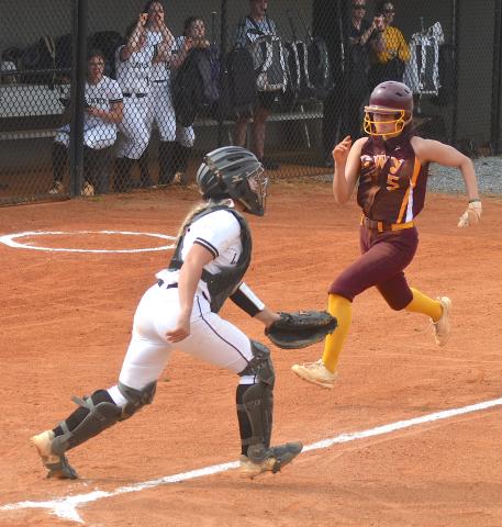 Gary Corsair • Clay County Progress Hayesville catcher Faith Odell waits for a throw from the outfield as Cherokee scores another run.