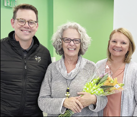 Hayesville Primary School Teacher Assistant of the Year Rosemary Russo-Wells, center, was honored with flowers by Clay Schools Superintendent Dale Cole and HPS principal Heather Plemmons.