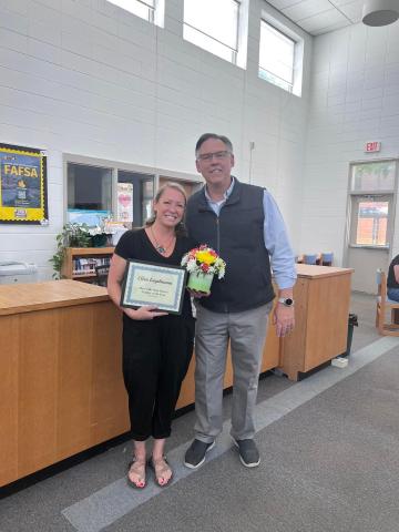 Ellen Engelmann, Hayesville High School art teacher, was chosen as HHS Teacher of the Year by her coworkers, HHS principal Stacey Overlin presented a certificate and flowers to her on behalf of the school.