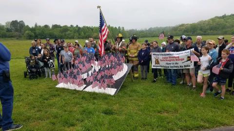 Participants gather at the 22 flags symbolizing the number of veterans on average committing suicide each day. Saturday’s walk to raise suicide awareness generated solid participation from various members of the community including the sponsors’ American Legion Post 532, Clay Fire Department and Sheriff’s Office along with representation from Towns County law enforcement.
