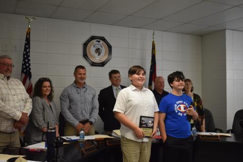 Hayesville Middle School administration recognized Hayden Lewis, left, as Hayesville Middle School hero for using the Heimlich maneuver to save Sean Morris, right.