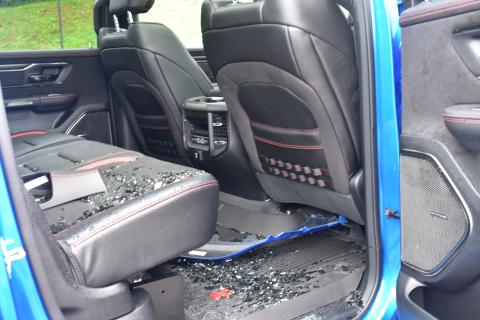 Midge Roach • Clay County Progress Glass shards fill the right back floorboard of the 2021 Ram 1500 TRX where the window was broken to gain access.