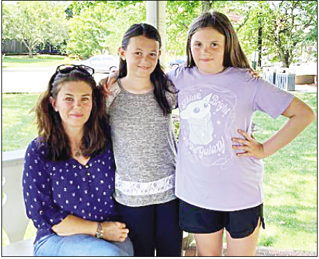 Marcia Barnes • Clay County Progress From left, Karen Scarbrough, daughters, Shelby and Aubrey, relax in the gazebo at Hayesville’s square on Friday, Aug. 25.