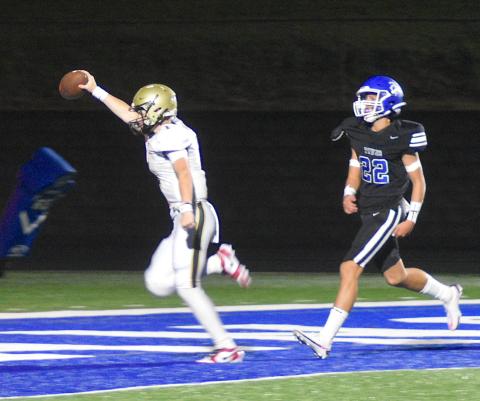 Gary Corsair • Clay County Progress Freshman Peyton McGaha celebrates a 39-yard touchdown run on his third play as a varsity quarterback. McGaha's beautiful run was nullified by a penalty, but No. 1 promptly completed a 31-yard pass to set up a touchdown.
