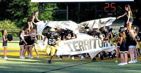 Gary Corsair • Clay County Progress Caden Robinson, No. 62, leads the JV Jackets onto the battlefield.