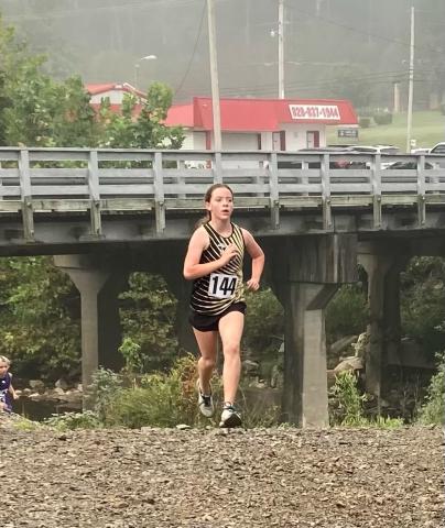 Annie Godfrey, 7th grade, attacks the home stretch.