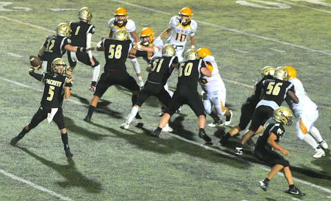 Gary Corsair • Clay County Progress   Hayesville's offensive linemen Peyton McGaha, No. 1, Dante Robinson, No. 58, E.J. Abrams, No. 51,  Lane O'Dell, No. 60, Patrick Denton, No. 50, Will Brown, No. 56, Dawson Devane, No. 32, and Cole Vining, No. 10, provide total protection for quarterback Tate Roberts, No. 5.