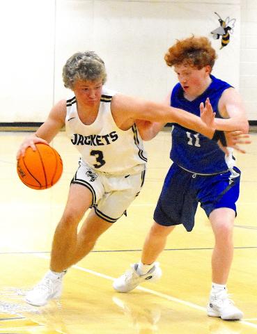 E.J. Abrams, No. 3, thunders down the lane during his 32-point explosion against Hiwassee Dam.