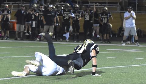 Gary Corsair • Clay County Progress Hayesville linebacker Taylor McClure flattens Andrews running back Holden Todd for a loss on a crucial third-down play midway through the fourth period.