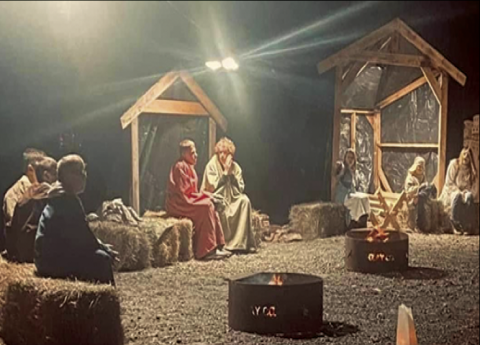 Allie Mauney •Photo Volunteers from New Life Church where Greg Carrol is pastor brave the chilly, wet weather for three hours on Dec. 8 and 9 to set up a Nativity at the Clay County Rec Department Campground. Attendees were treated to a multitude of lighted Christmas display in the drive-thru event that received rave reviews.
