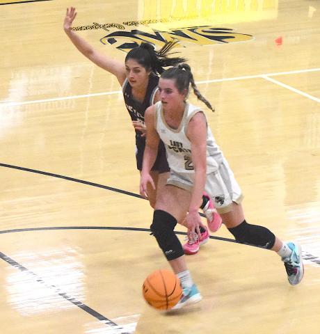 Gary Corsair • Clay County Progress Yellow Jacket guard Ava Shook, No. 2, breaks through the Maroon Devil's full-court press.