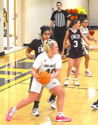  Gary Corsair • Clay County Progress Hayesville's Ava Moore, No. 40, goes to work on the low block against Swain County while Aaliyah Jackson, No. 2 looks on. Moore led the Yellow Jackets in scoring with 10 points.