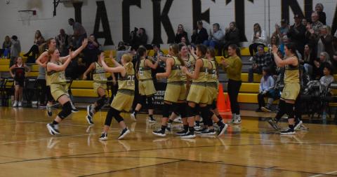 Kelce Oliver • Clay County Progress The Lady Jackets trade high fives in celebration of their win against the Andrews Wildcats.