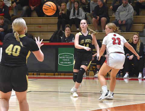 Gary Corsair • Clay County Progress Briley Clampitt, No. 14, rotates the ball to Brooke Graves, No. 40, as Hayesville looks for a way to attack Franklin's defense.