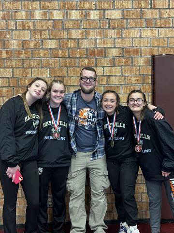 From left, Katie Miller, Lakota Shelton, Coach Daniel Sherlin, Lilli Denton and Amyna Denton take home medals at tournament.