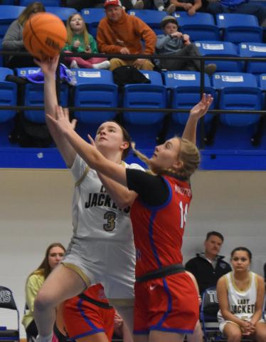 Gary Corsair • Clay County Progress Yellow Jackets guard Jasmine Brooks, No. 3, scores on a layup in Hayesville's convincing win against Polk County.