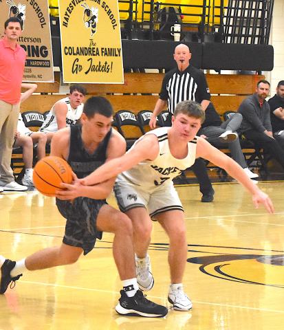 Gary Corsair • Clay County Progress E.J. Abrams, No. 3, tries to steal the ball at Robbinsville.