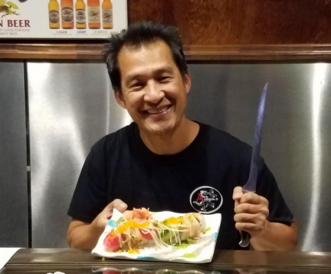 Koo Lim at their family restaurant Asiano serving up a meal for patrons. He admted that breakfast is actually his favorite meal.